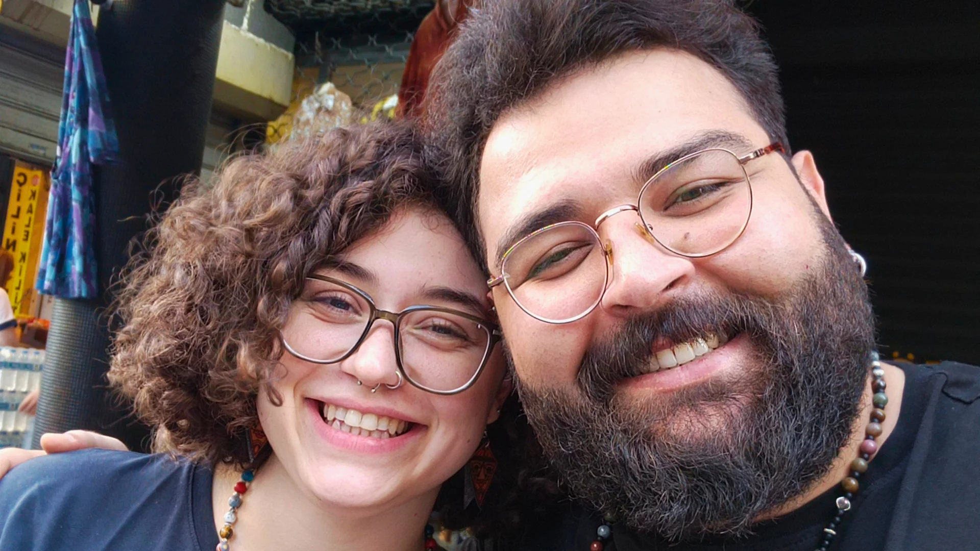 Bekir and Seha smiling outdoors